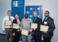 Queensborough CC award-winning students with President Diane B. Call at USS Intrepid Sea Air Space Museum
